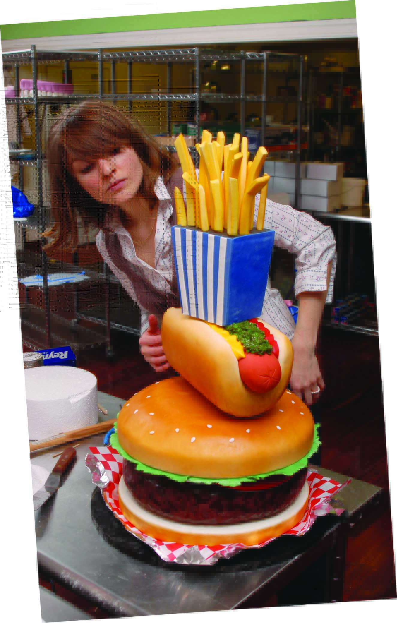 Woman observing model of fast food items