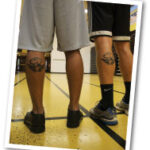 guys show their UMBC tattoos