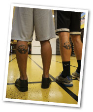 guys show their UMBC tattoos