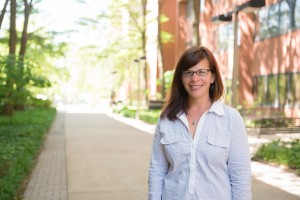 Portrait of Rebecca Adelman standing outside on academic row.