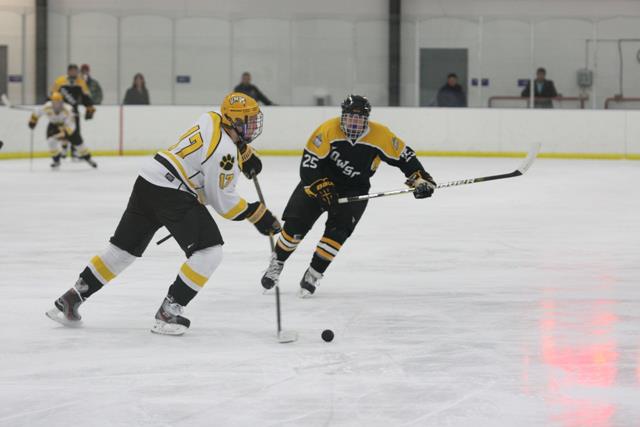 Matthew Kelly completes a pass in a UMBC ice hockey team game