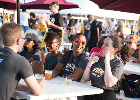 Enjoying the sunshine and ale crafted by alumni founded Suspended Brewing Company in the beer garden.