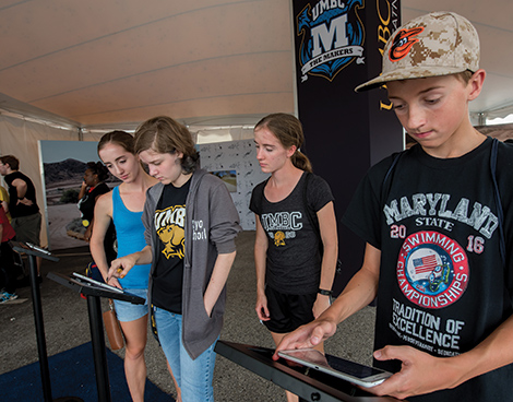 Future UMBC alumni get hands-on experiences with gaming and prototyping at the Makers Tent in the House of Grit.