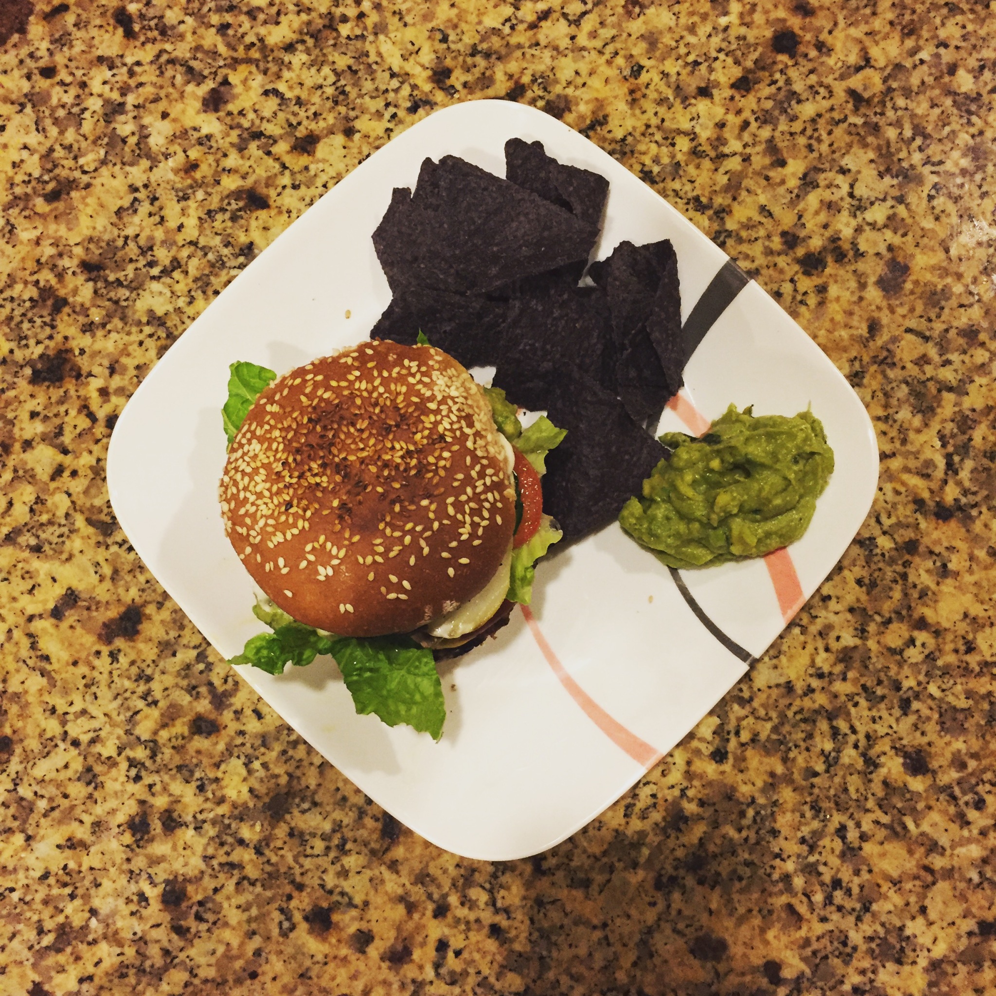 table with sandwich chips and guacamole
