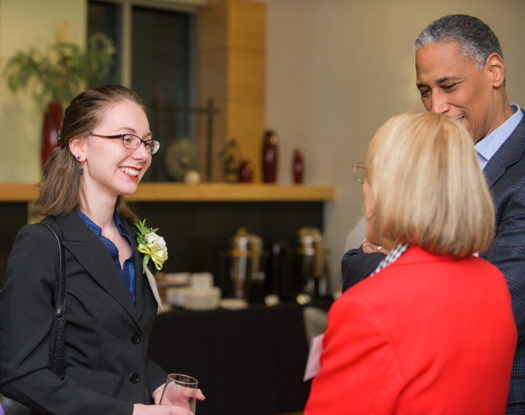 Stormy Hill '17 meets Barbara Hill and Ancelmo Lopes. Photo Marlayna Demond '11.