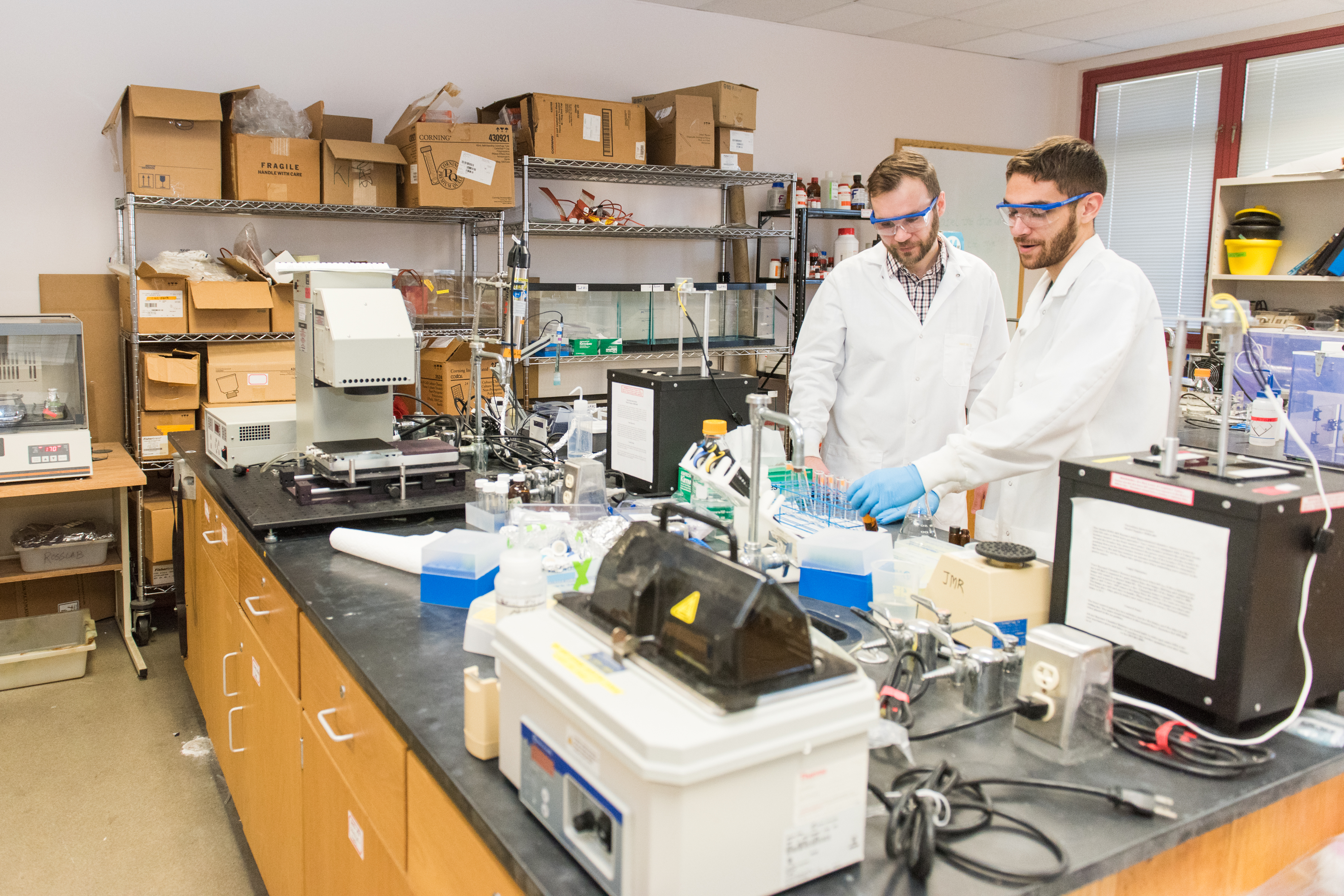 Lee Blaney, and Daniel Ocasio '17, chemical engineering, working in the lab.