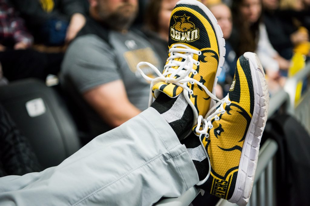 Close-up shot of UMBC Retriever sneakers being worn by someone at a game.