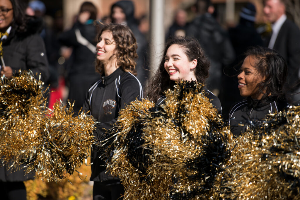 Cheerleaders in black and gold.