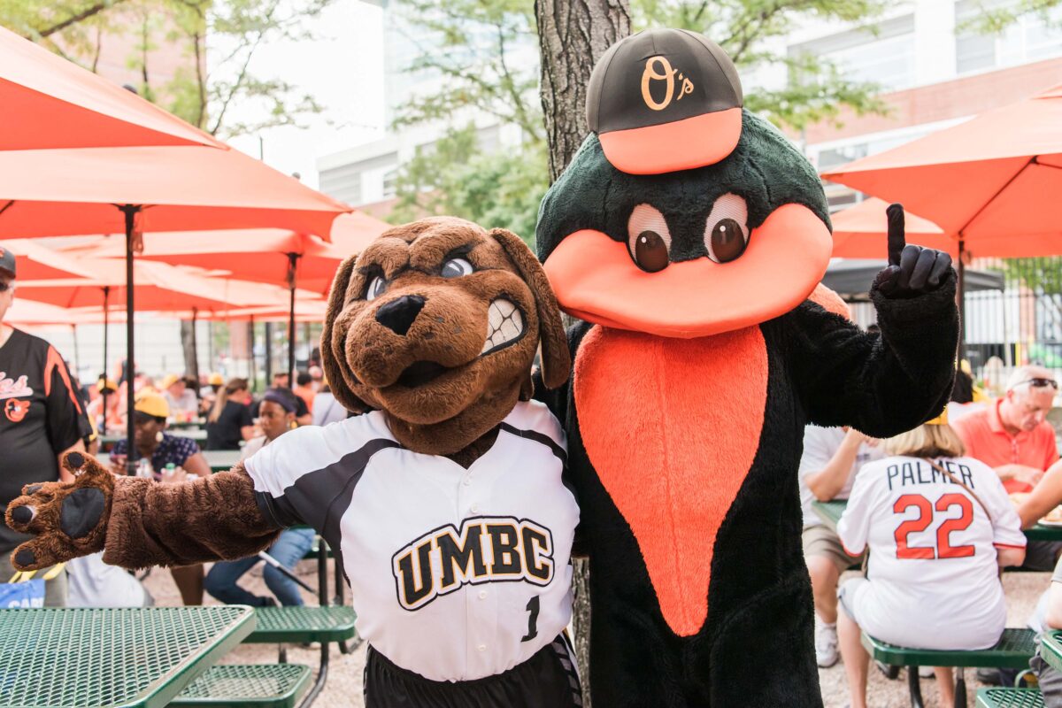 Orioles and UMBC Mascot posing together