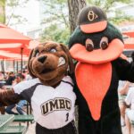 Orioles and UMBC Mascot posing together