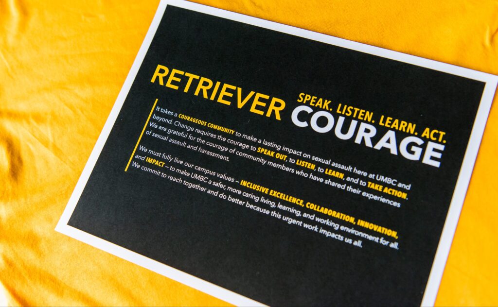 Flyer reads "Retriever Courage: Speak. Listen. Learn. Act." and includes a mission statement.