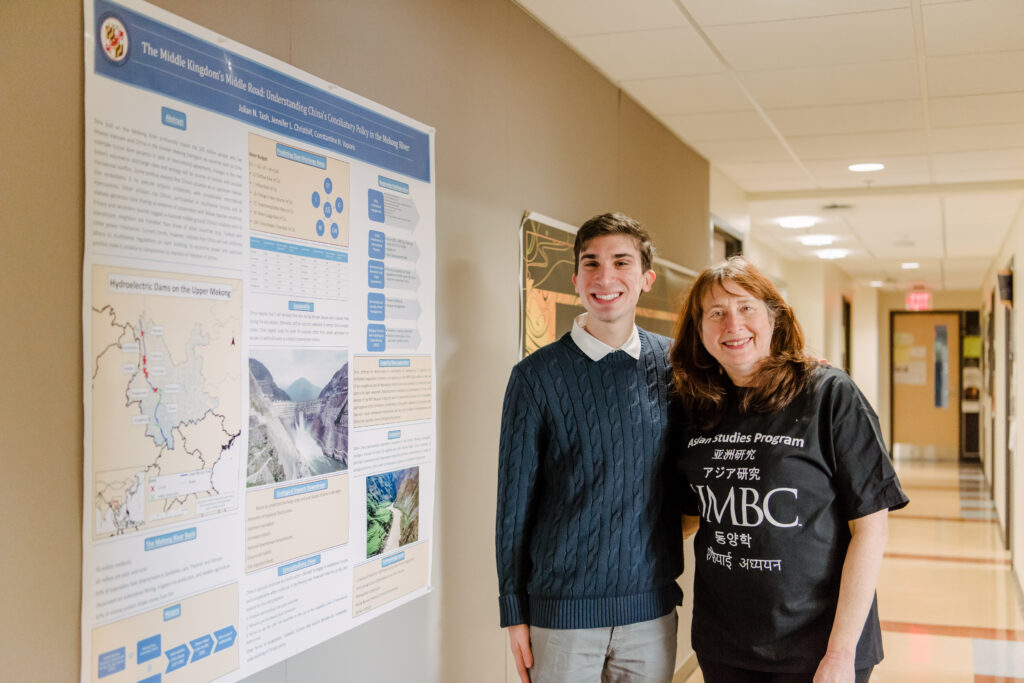 Student and mentor at research poster