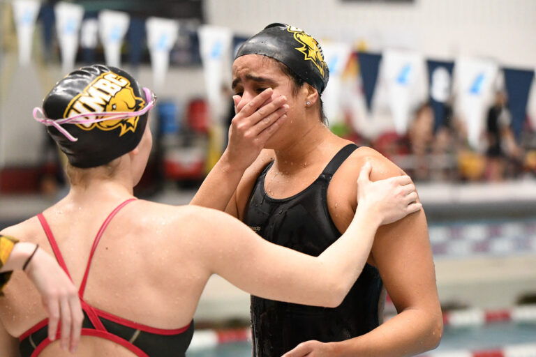 An emotional Hania Moro celebrates with teammates after breaking a school record. Photo courtesy of Colleen Hummel.