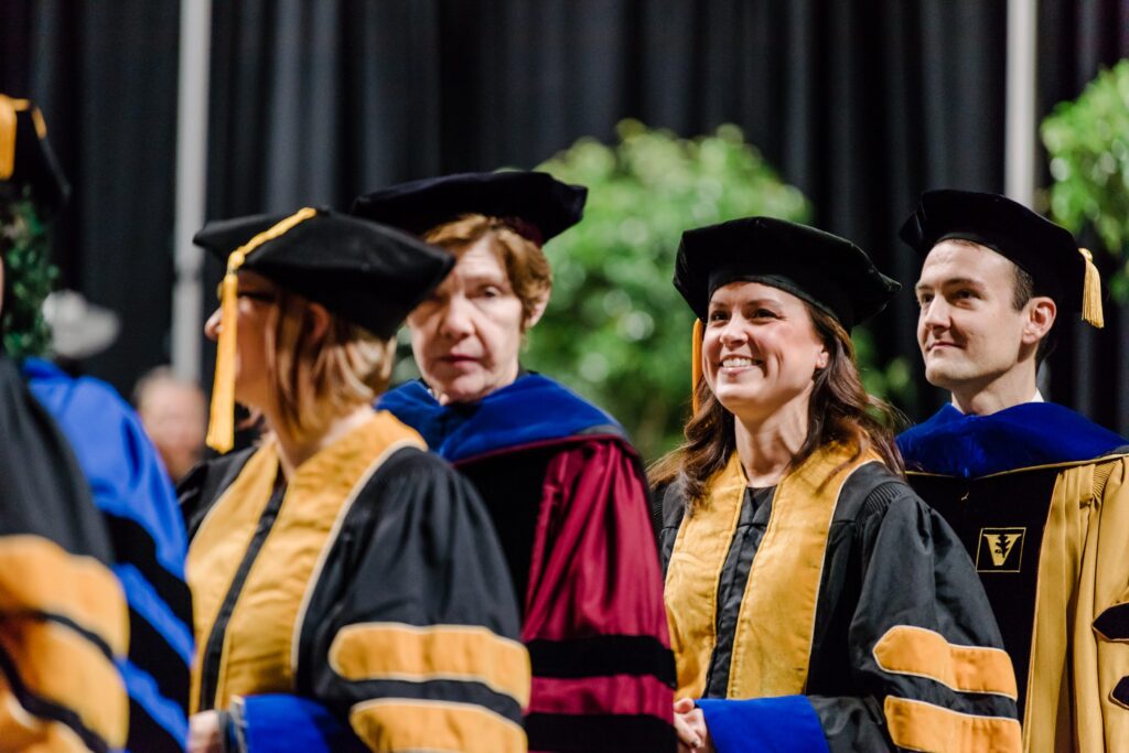 UMBC graduate and Ph.D. students celebrate commencement in May 2018.