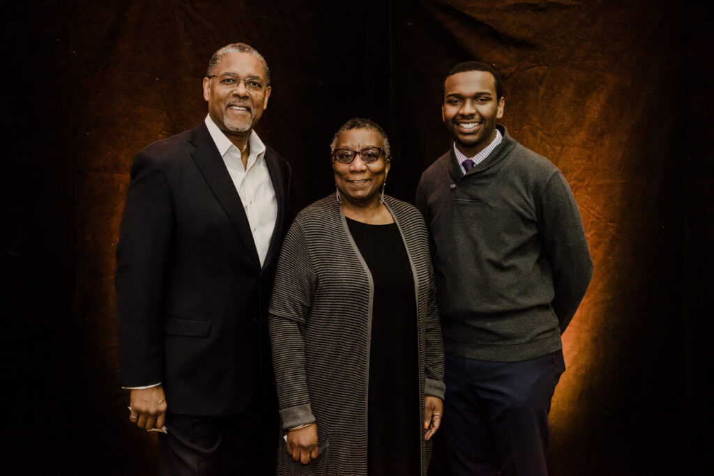 Jean-Marie and Alison Mayas with student Evan Carlyle. 