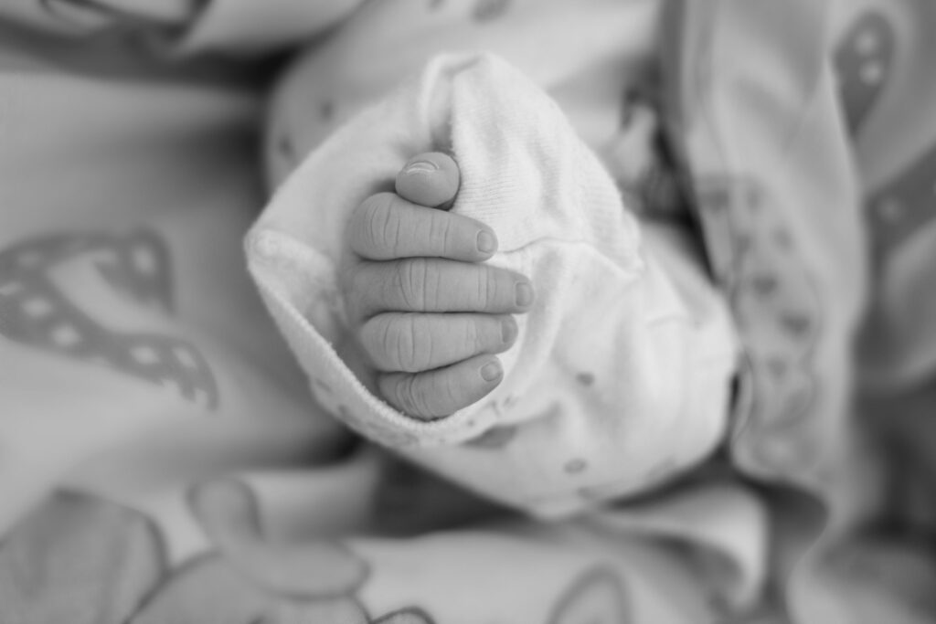 An infant's hand. Photo by Limor Zellermayer on Unsplash.com.