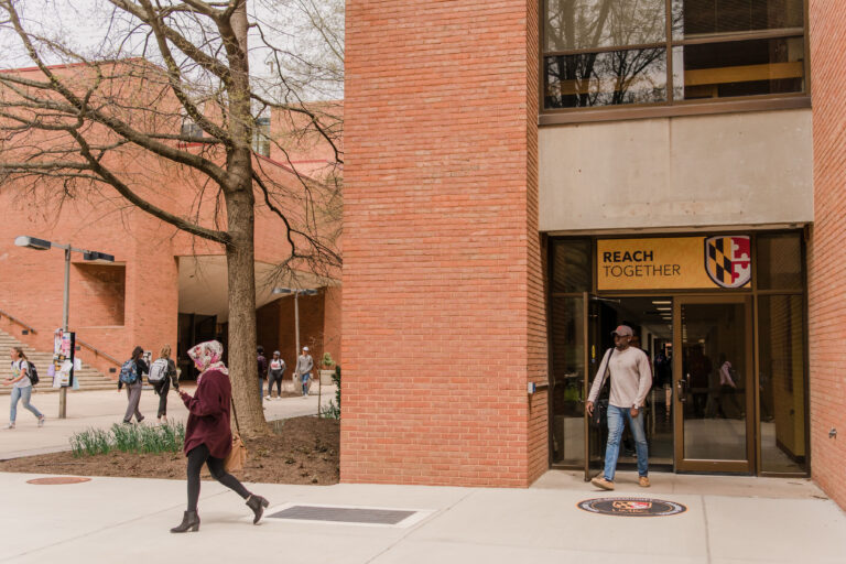 New branded imagery adorns campus doorways.