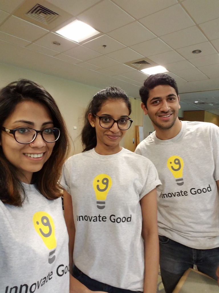 Three students wearing matching shirts that say "Innovate Good"