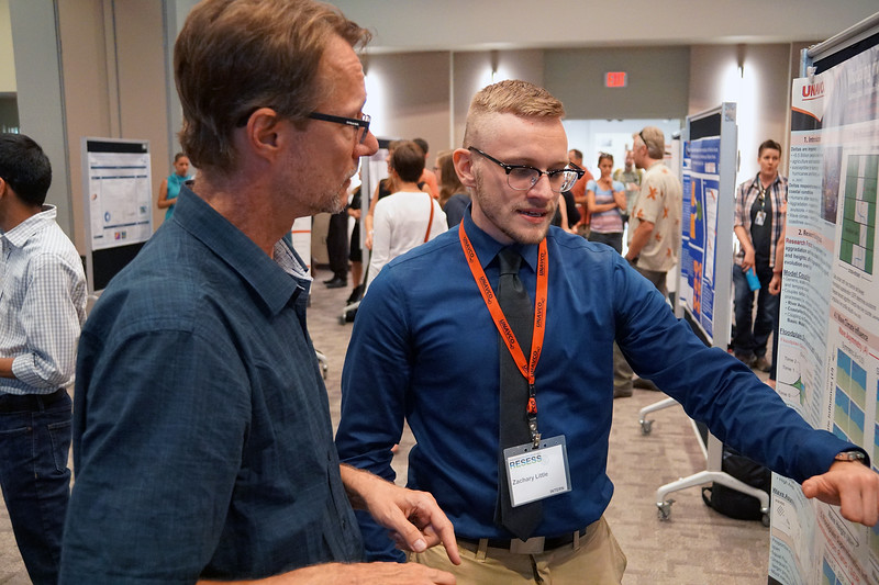 Zachary Little, a 2018 RESESS intern, discusses his summer research with CU Boulders Greg Tucker. August 2, 2018. Boulder, Colorado. (Photo/Daniel Zietlow, UNAVCO)