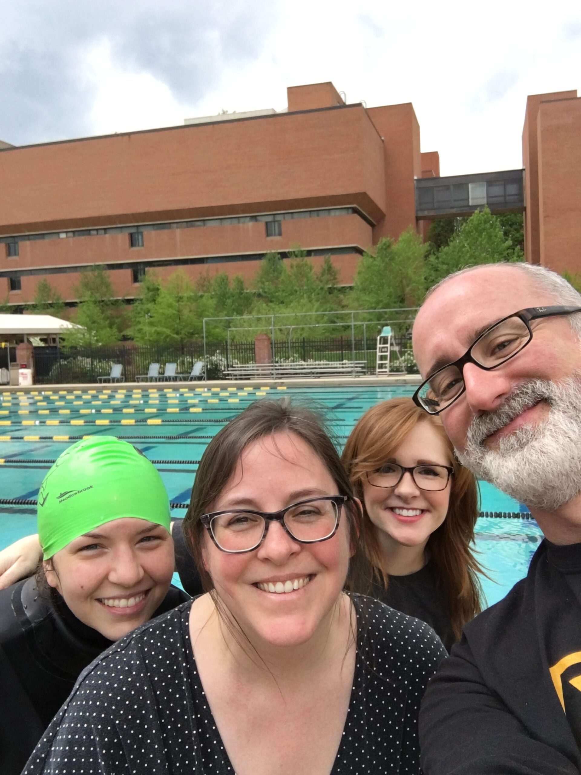 staff takes selfie by pool