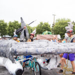 The Kinetic Sculpture team prepares the shark before the race. Photo by Marlayna Demond '11.