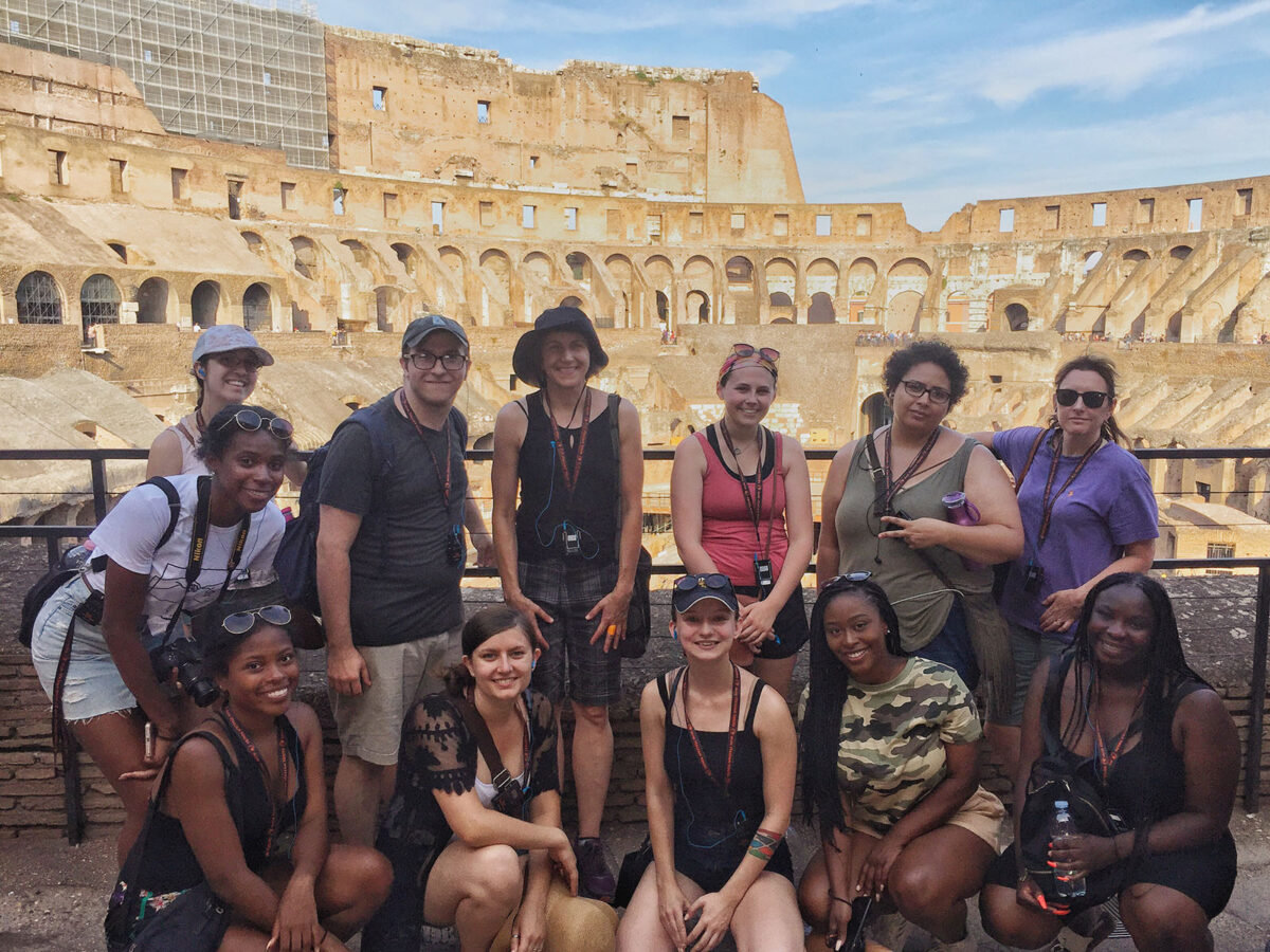 UMBC students enjoy a group dinner in France during a summer abroad trip.