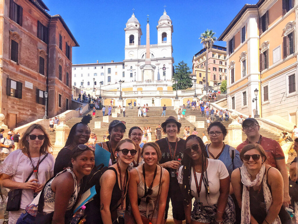 Students enjoy the sunshine on a summer trip to Italy.