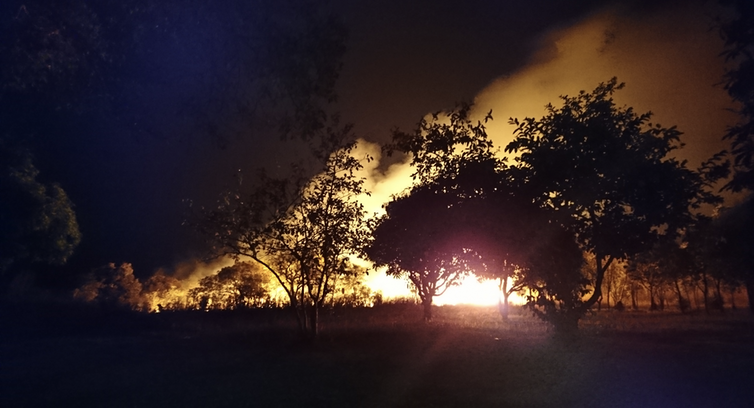 Human practices like burning the landscape – as in this night bush fire outside Kabwe, Zambia – have been affecting the Earth since long before the nuclear era.Andrea Kay, CC BY-SA