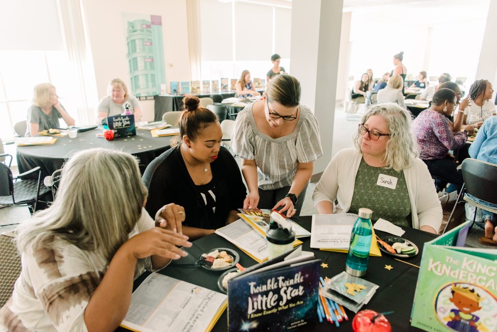 Meta-McMahon (third from left) working with Baltimore City teachers.