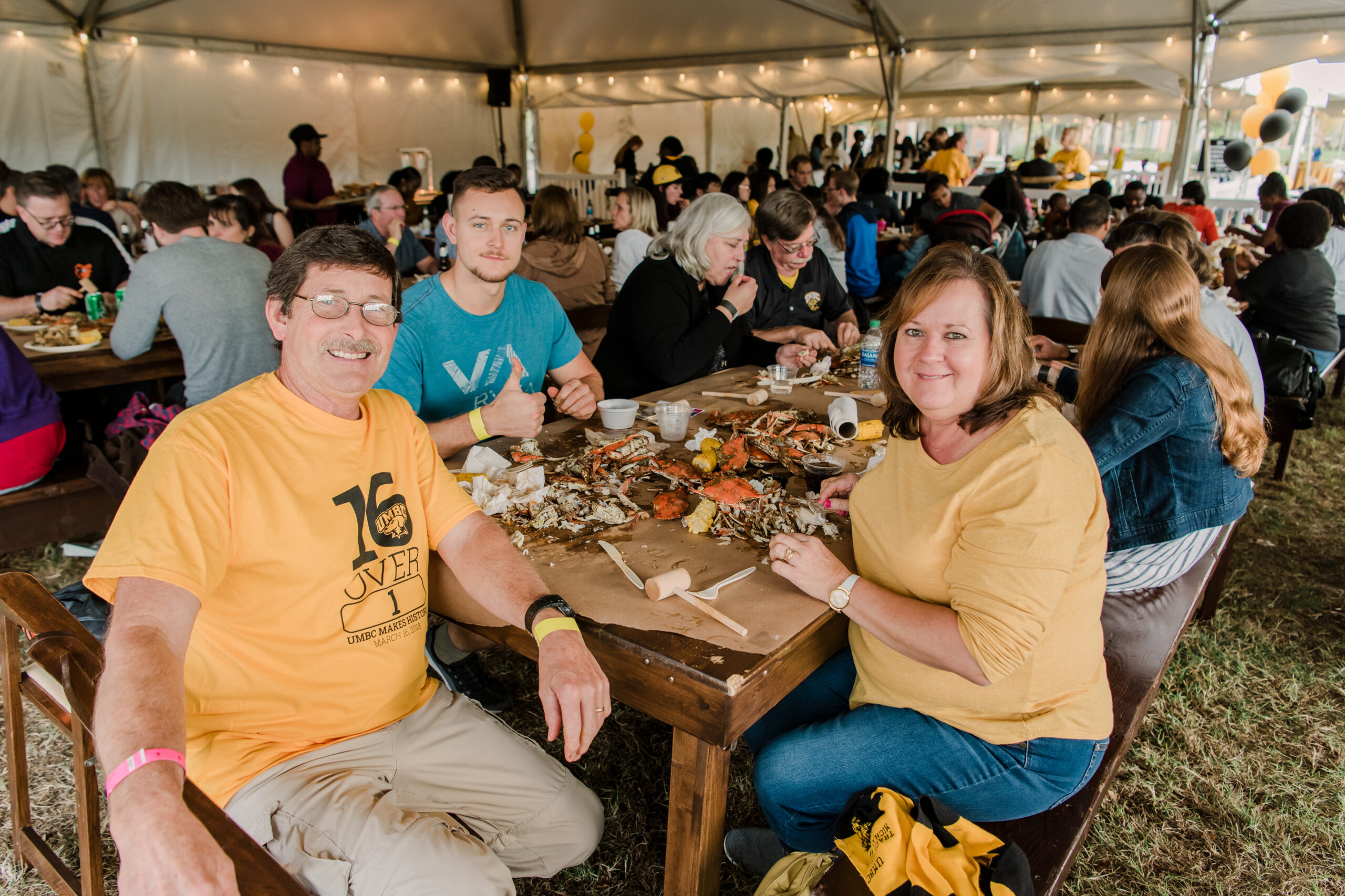 People smiling at the 2019 crab feast