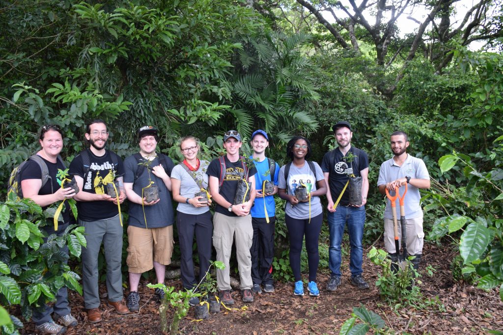 Maggie Holland and Lee Blaney, associate professor of chemical, biochemical, and environmental engineering, about to plant trees at a coffee plantation in Costa Rica with a group of UMBC students. Photo courtesy Maggie Holland.