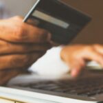 A person uses a credit card online.
