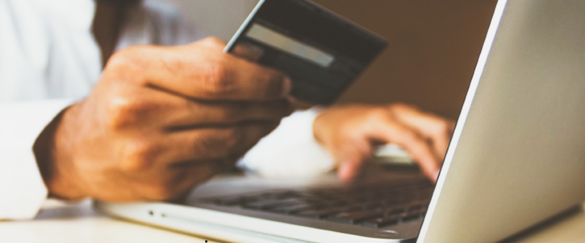 A person uses a credit card online.