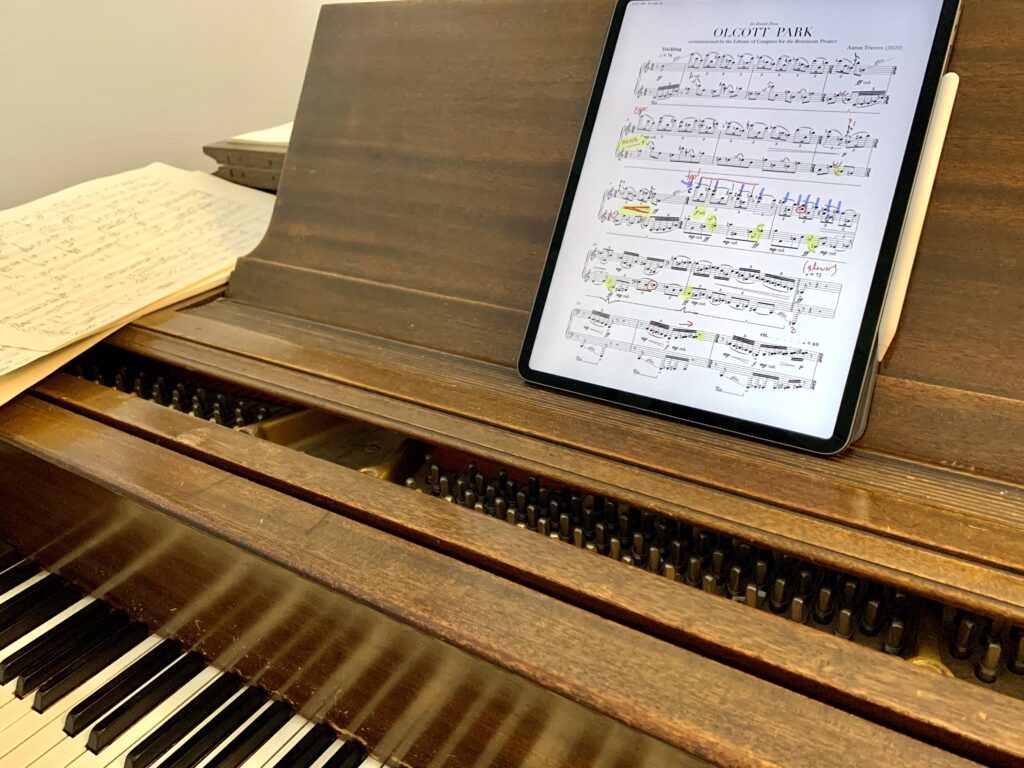 The score of Olcott Park resting on the rack of Pesca’s piano.