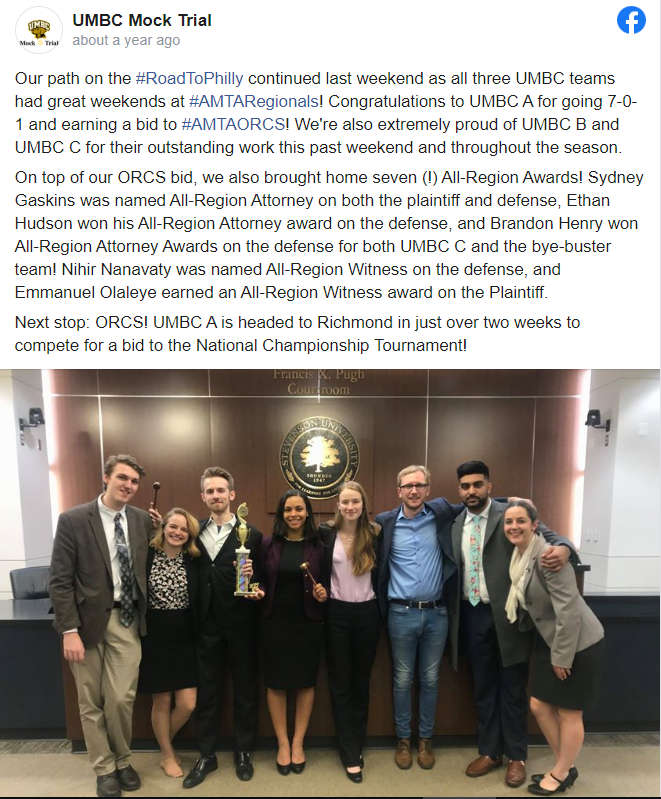 Face book post of UMBC Mock Trial from 2019 with text describing several competition wins and  below it a picture with eight young people dressed in suits standing in a Stevenson University office.