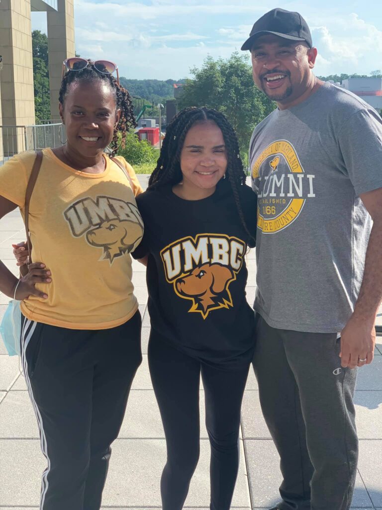 Parents and daughter in UMBC clothing