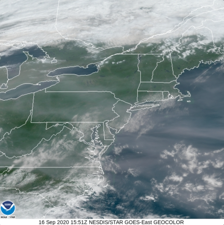 A satellite photo of the Eastern U.S. with a haze of smoke visible.