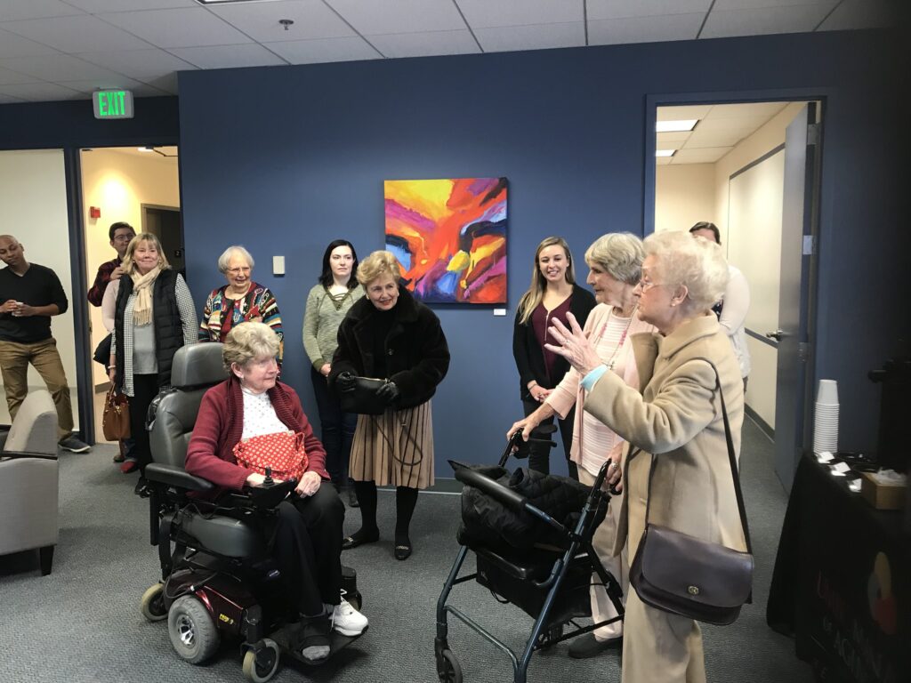 Senior citizens talk about their art exhibit