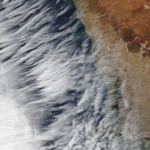 satellite image of clouds along a coastline
