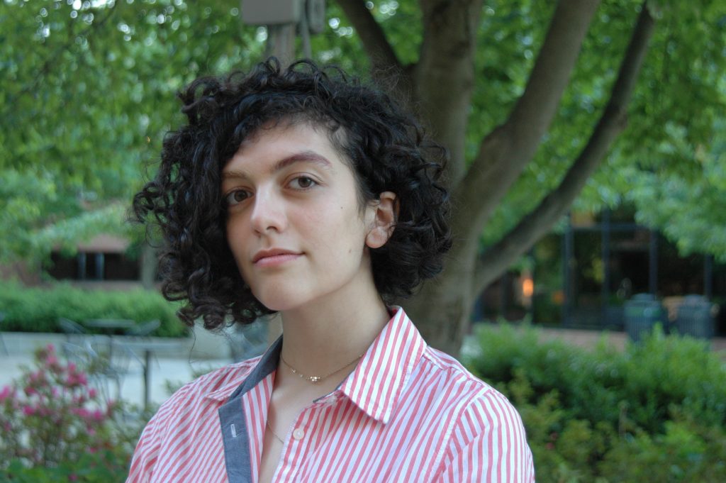 headshot of a woman in front of a tree