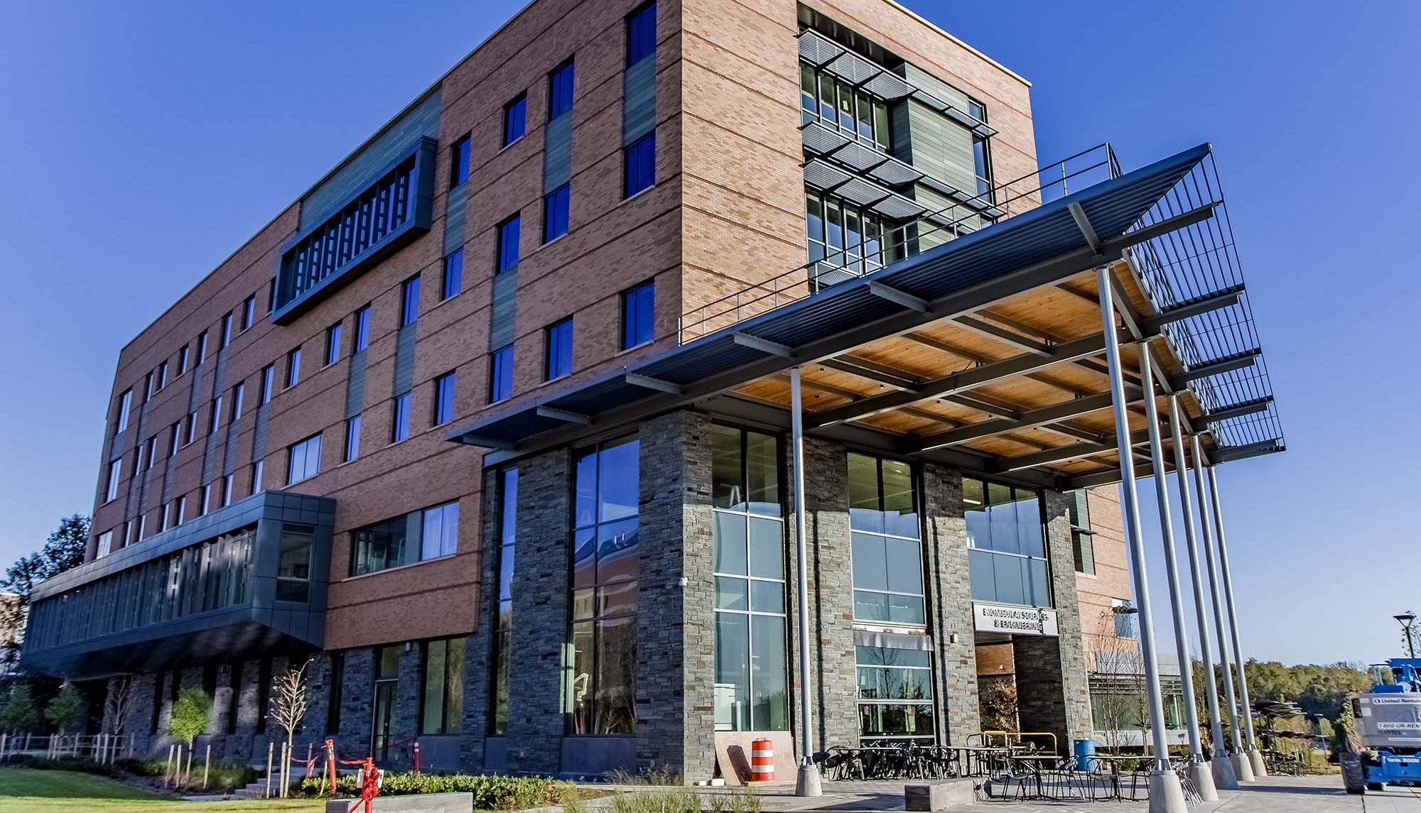 One of many buildings on the Shady Grove campus, surrounded by a bold blue sky.