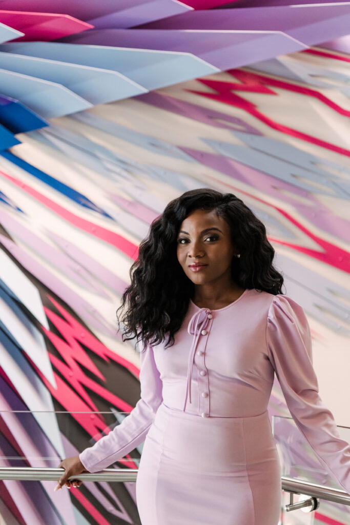 Kizzmekia Corbett '08 poses in UMBC's new Life Sciences Building