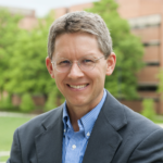 Portrait of Dr. Michael Summers standing outside