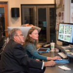 Chancellor Bob Caret and Ganna Vikhlyayeva '15, animation and interactive media, in UMBC's Imaging Research Cente