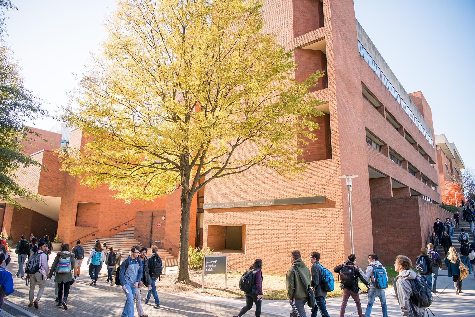 When classes are in session, UMBC's academic row is bustling with students. Pictured here is a crowd of busy students walking around the Meyerhoff Chemistry Building.