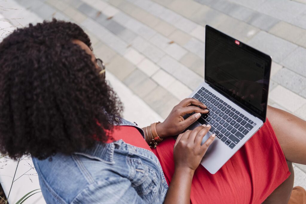 Woman using a laptop.