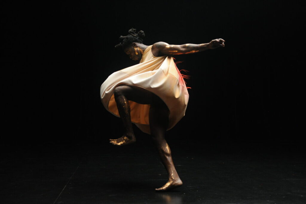 A dancer against a dark background