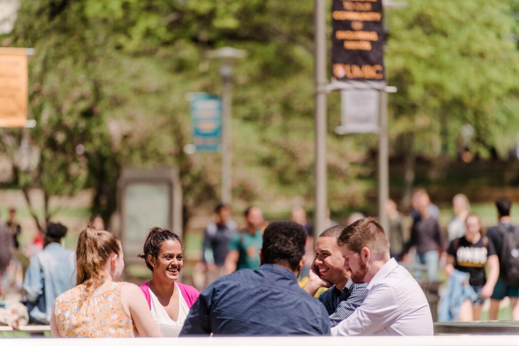 A group of students sitting outside together.