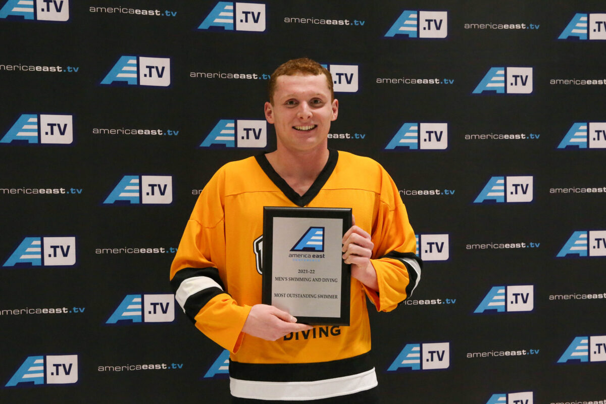 Weigelt poses with the America East Outstanding Swimmer plaque. 