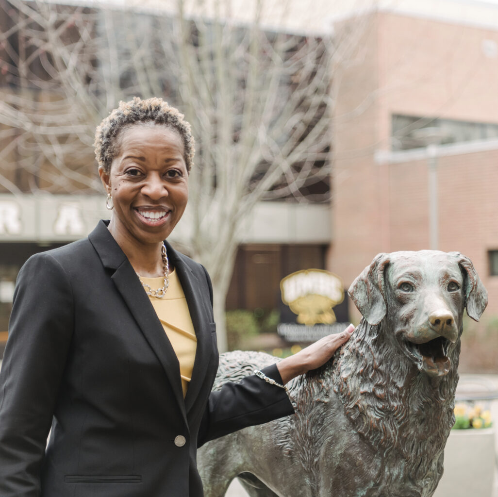UMBC President Valerie Shears Ashby poses with True Grit statue